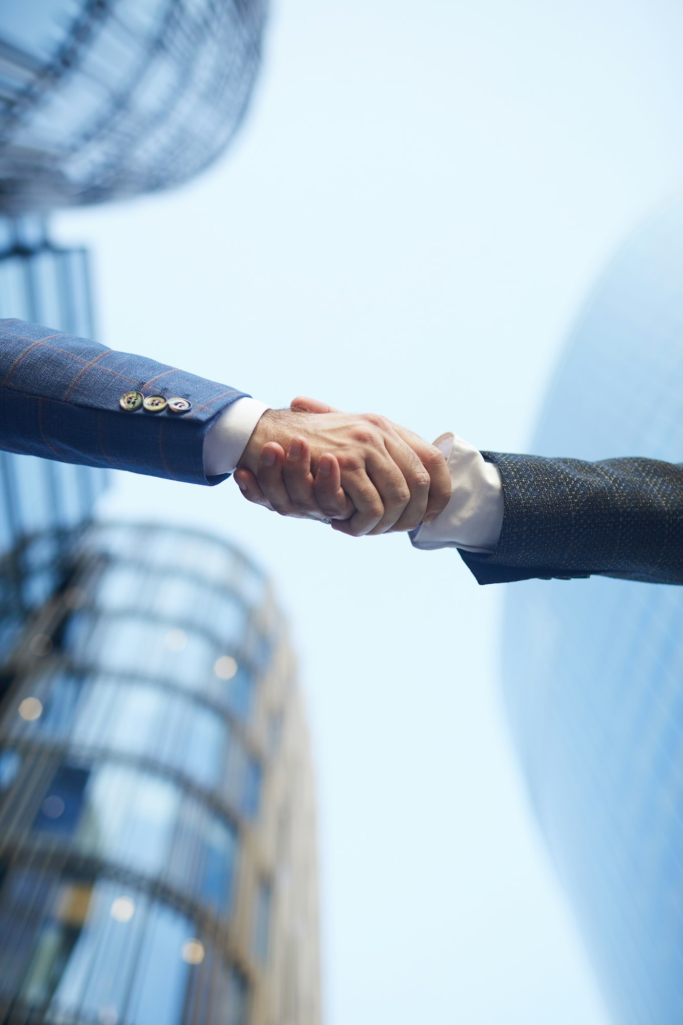 Business handshake outdoors